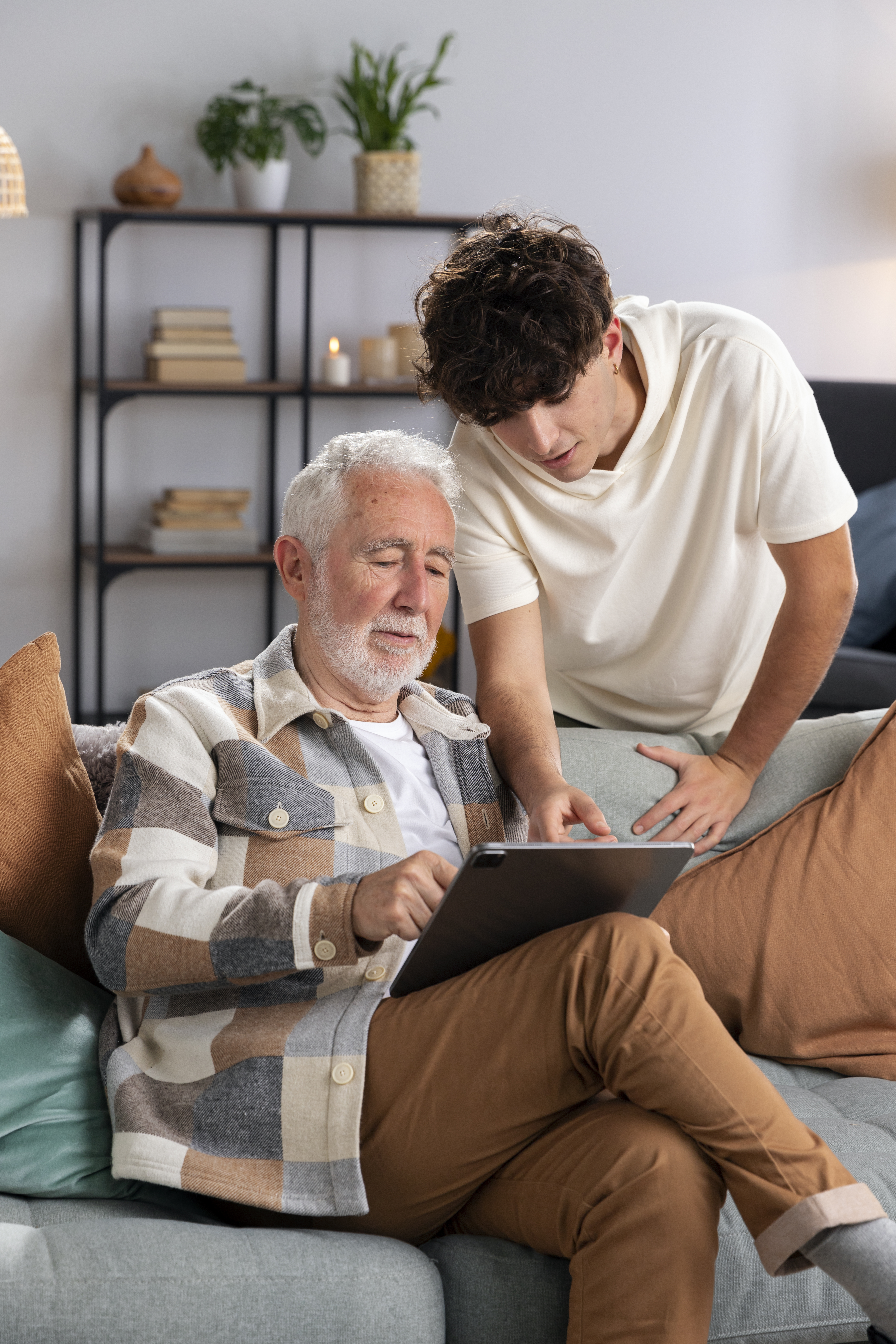 Studenting Helping Senior with Tablet